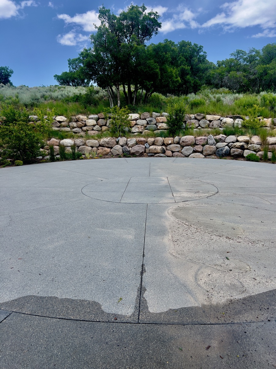 Professional pressure washing service transforming concrete driveway in Park City Utah